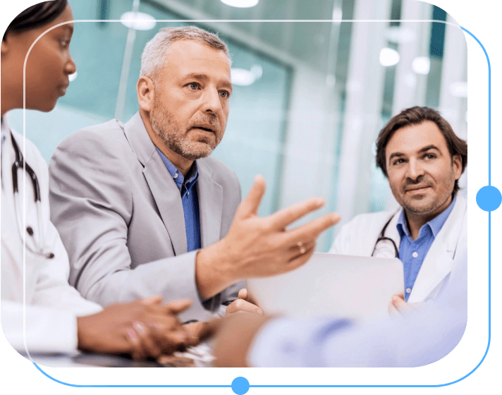 A group of doctors sitting around a table.