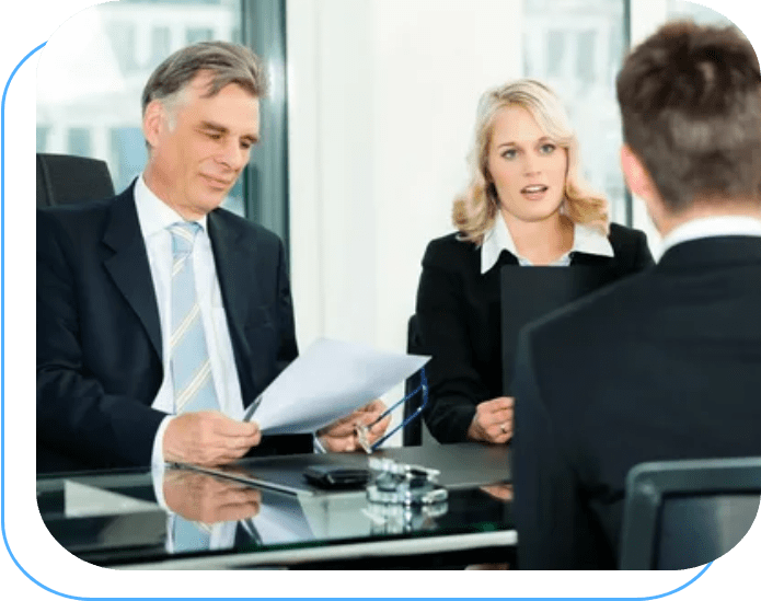 A man and woman in business attire are interviewing.